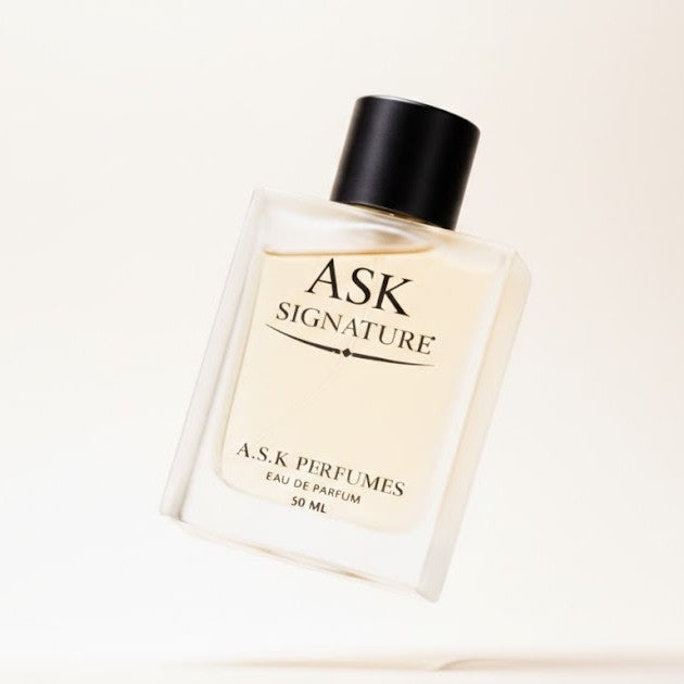 Perfume bottle labeled 'ASK Signature' by A.S.K. Perfumes on a light beige background